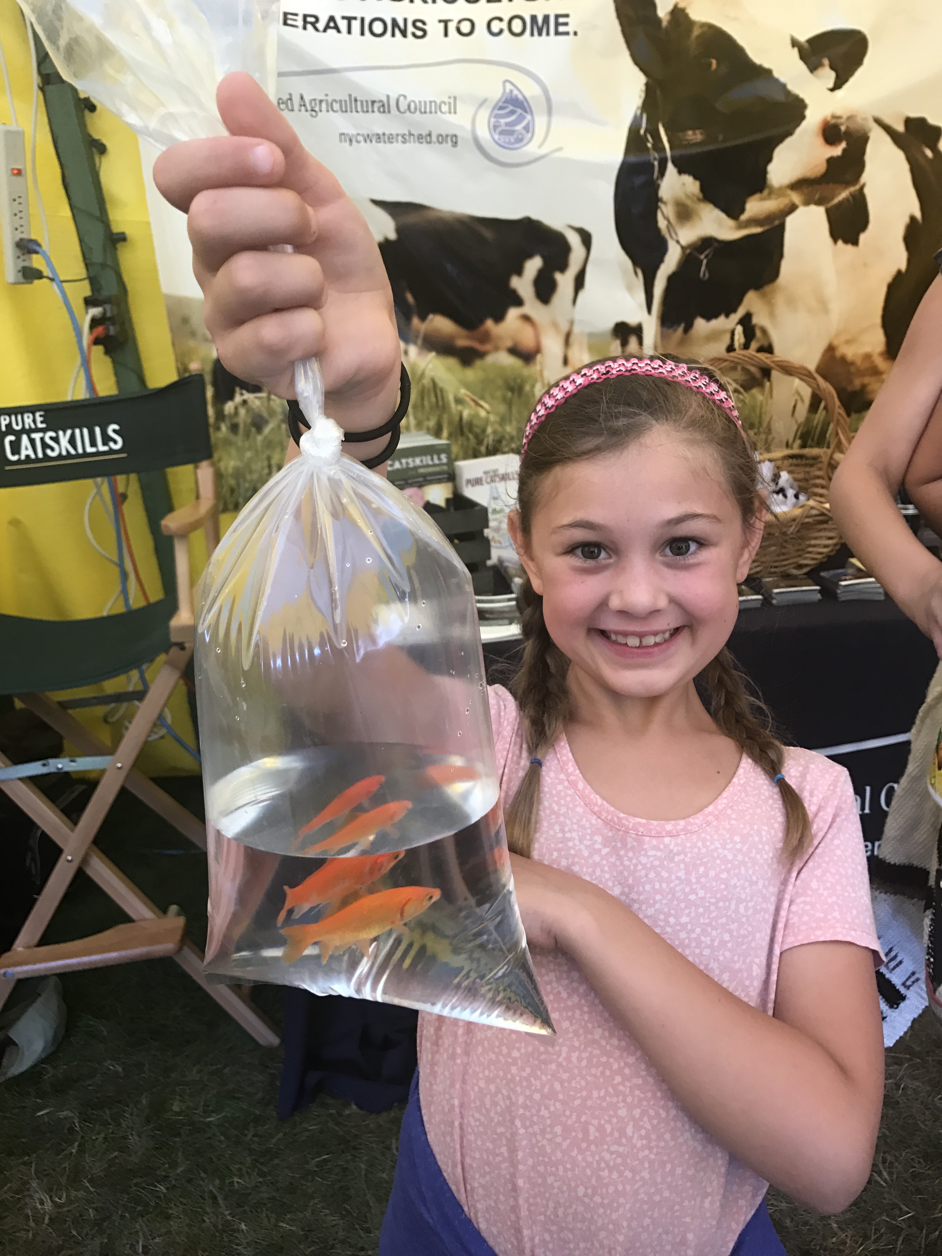 Paisley showing off her fish in the WAC tent